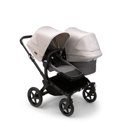 Bugaboo Donkey 5 Duo seat and bassinet stroller with black chassis, grey melange fabrics and misty white sun canopy.