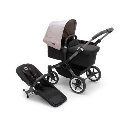 Bugaboo Donkey 5 Mono bassinet stroller with graphite chassis, midnight black fabrics and misty white sun canopy, plus seat.