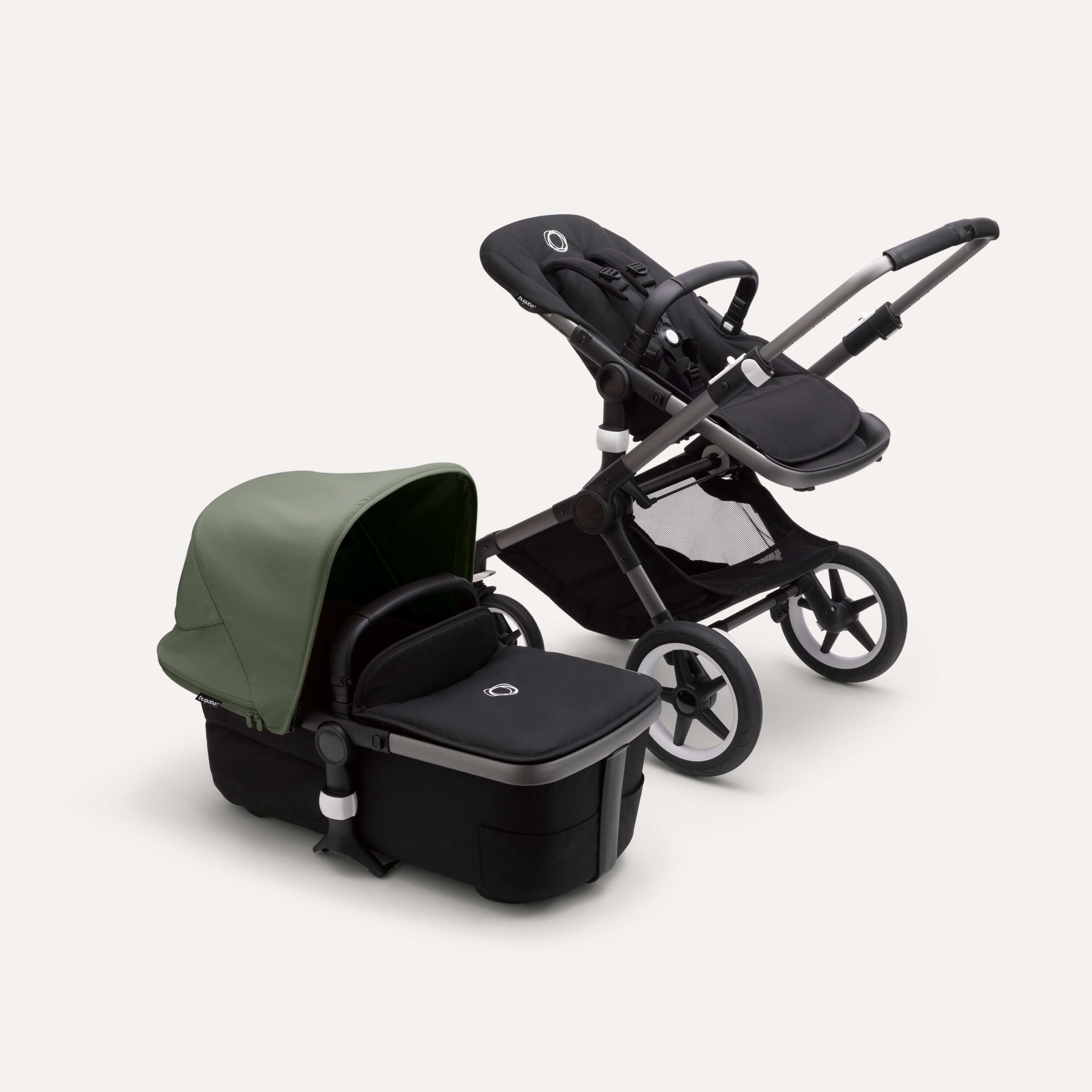 Bugaboo Fox 3 bassinet and seat stroller with graphite frame, black fabrics, and forest green sun canopy. - Main Modal Image Slide 5 of 7