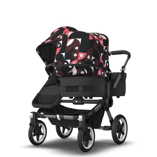 Bugaboo Donkey 5 Duo bassinet and seat stroller graphite base, midnight black fabrics, animal explorer pink/ red sun canopy - Main Image Slide 7 van 12