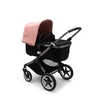 Bugaboo Fox 3 carrycot pushchair with graphite frame, black fabrics, and pink sun canopy.