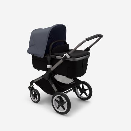 Bugaboo Fox 3 bassinet stroller with graphite frame, black fabrics, and stormy blue sun canopy.