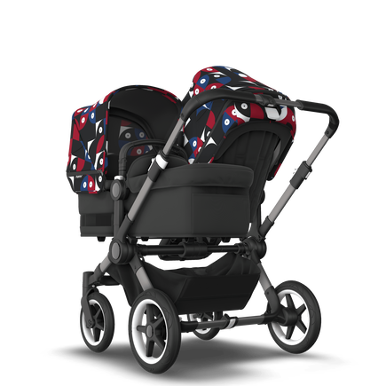 Bugaboo Donkey 5 Duo bassinet and seat stroller graphite base, midnight black fabrics, animal explorer red/ blue sun canopy - view 1