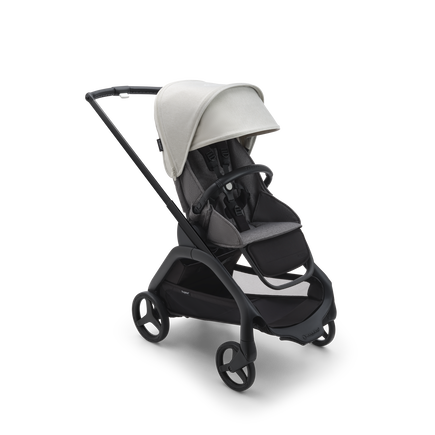 Bugaboo Dragonfly seat stroller with black chassis, grey melange fabrics and misty white sun canopy.