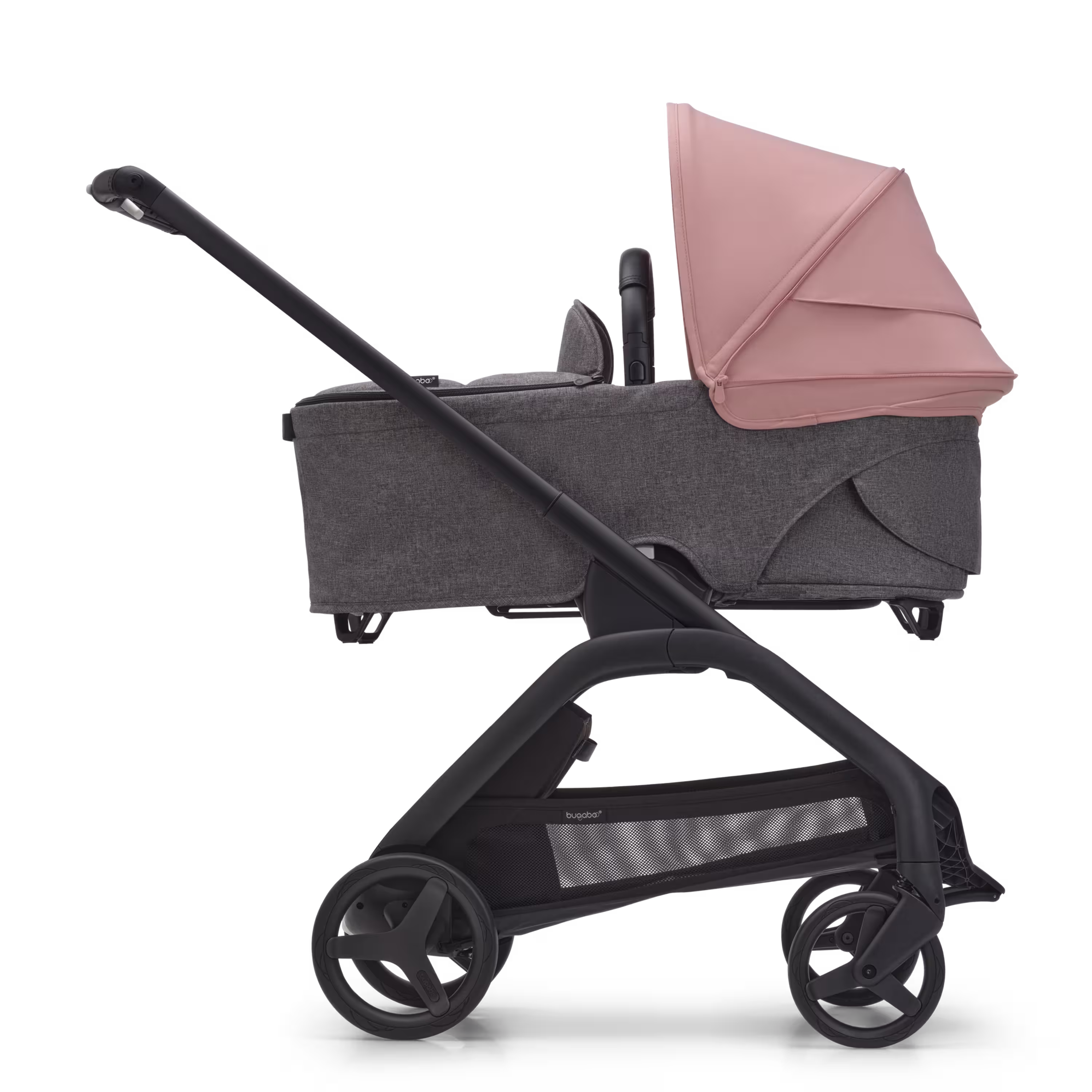 Side view of the Bugaboo Dragonfly bassinet stroller with black chassis, grey melange fabrics and morning pink sun canopy. - Main Modal Image Slide 3 of 15