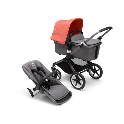 Bugaboo Fox 3 carrycot and seat pushchair with graphite frame, grey fabrics, and red sun canopy.