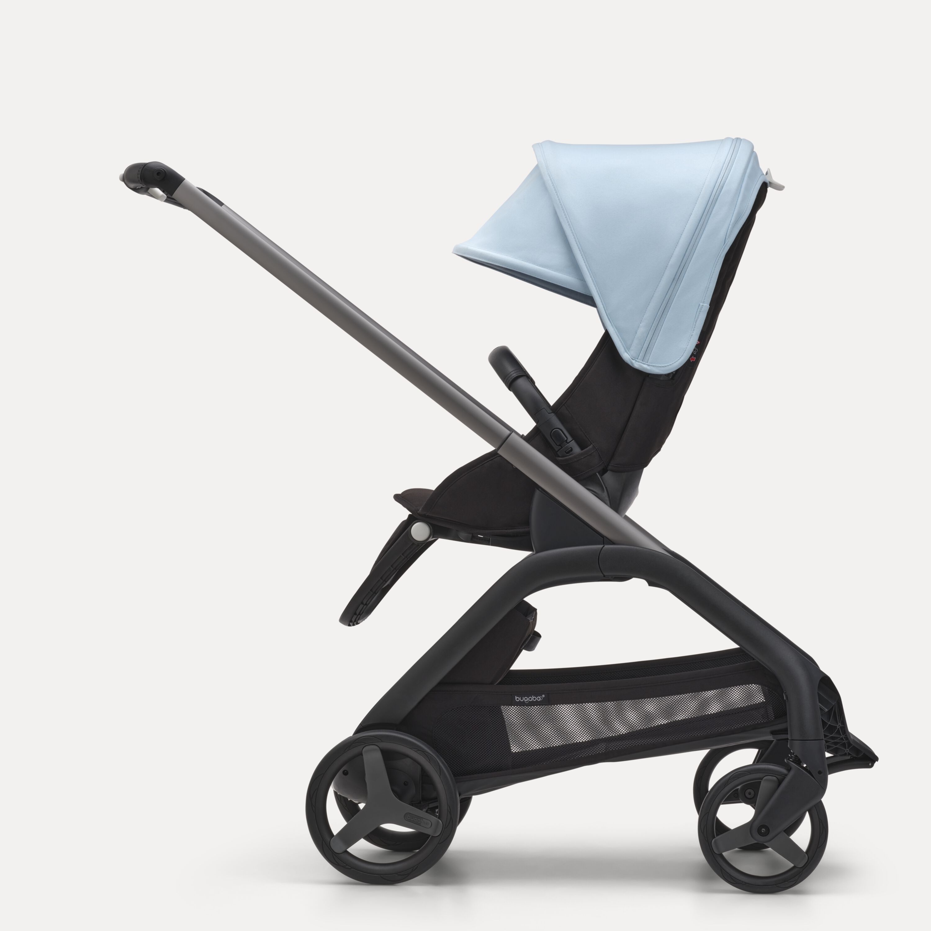 Side view of the Bugaboo Dragonfly seat stroller with graphite chassis, midnight black fabrics and skyline blue sun canopy. - Main Modal Image Slide 2 of 16