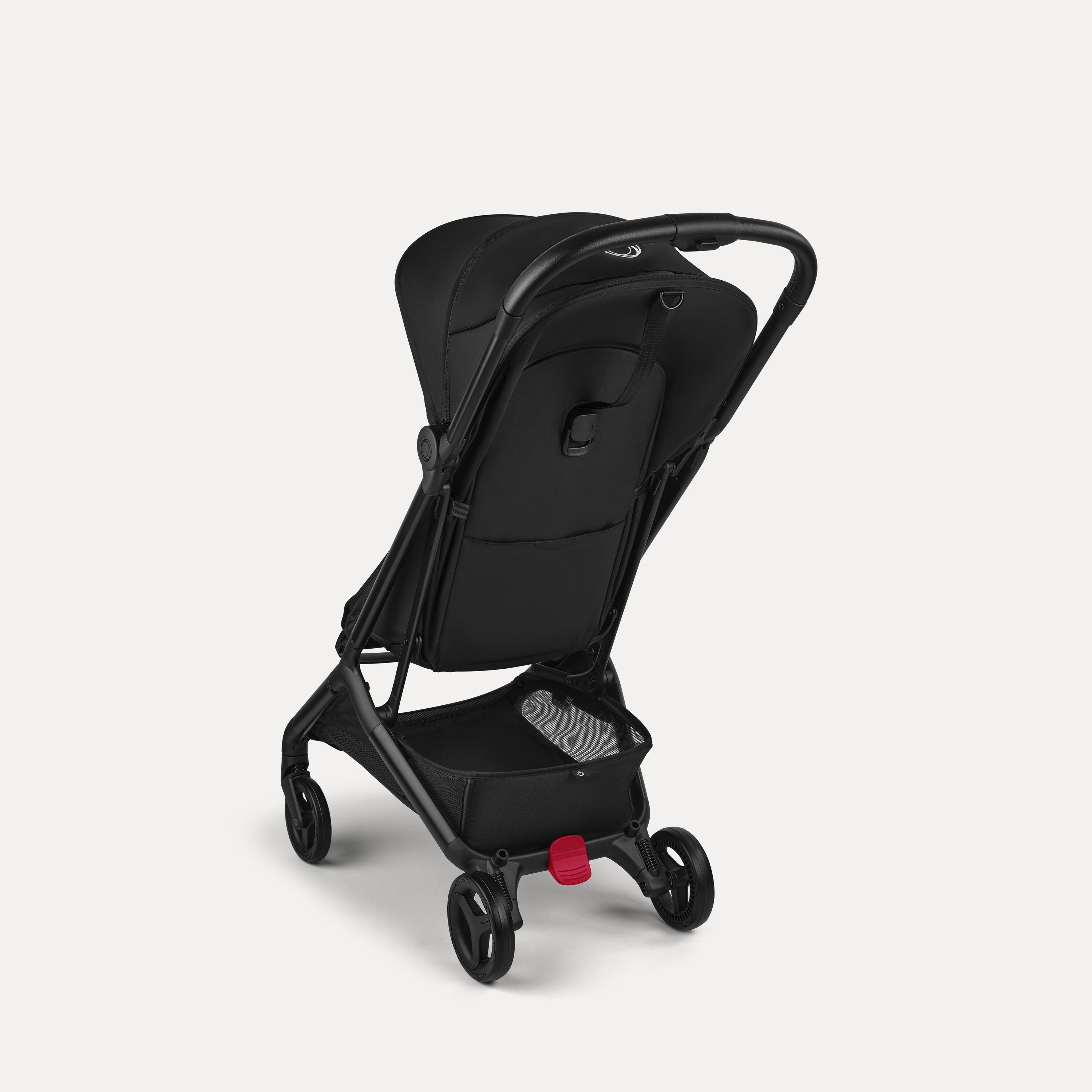 View from the back of a Bugaboo Butterfly 2 ultra-compact travel pram with black chassis, Heritage Black fabrics, and Heritage Black sun canopy. - Main Modal Image Slide 3 of 9