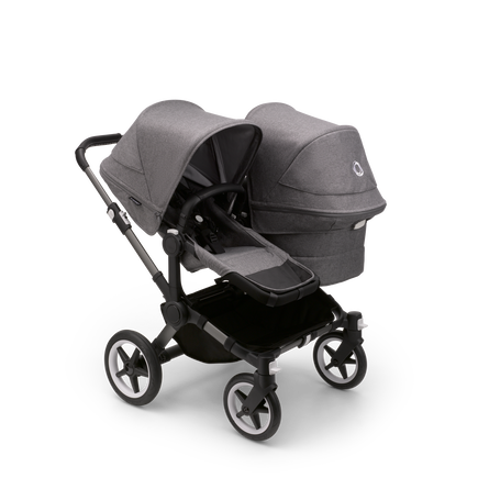 Bugaboo Donkey 5 Duo seat and bassinet stroller with graphite chassis, grey melange fabrics and grey melange sun canopy.