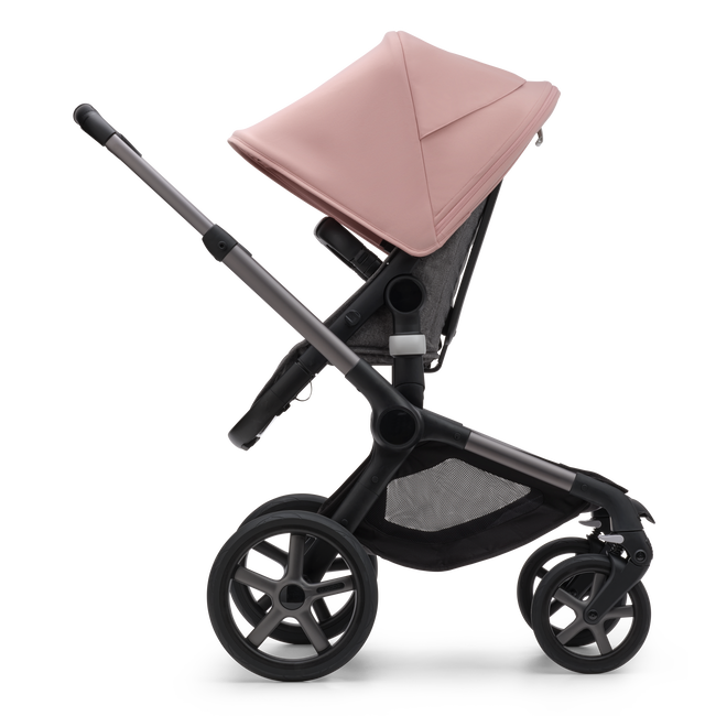 Side view of the Bugaboo Fox 5 seat stroller with graphite chassis, grey melange fabrics and morning pink sun canopy.