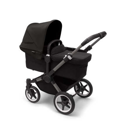 Bugaboo Donkey 5 Mono bassinet stroller with graphite chassis, midnight black fabrics and midnight black sun canopy.