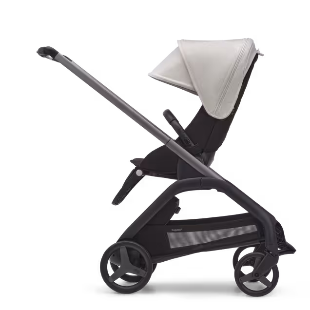 Side view of the Bugaboo Dragonfly seat stroller with graphite chassis, midnight black fabrics and misty white sun canopy. - Main Image Slide 2 of 16