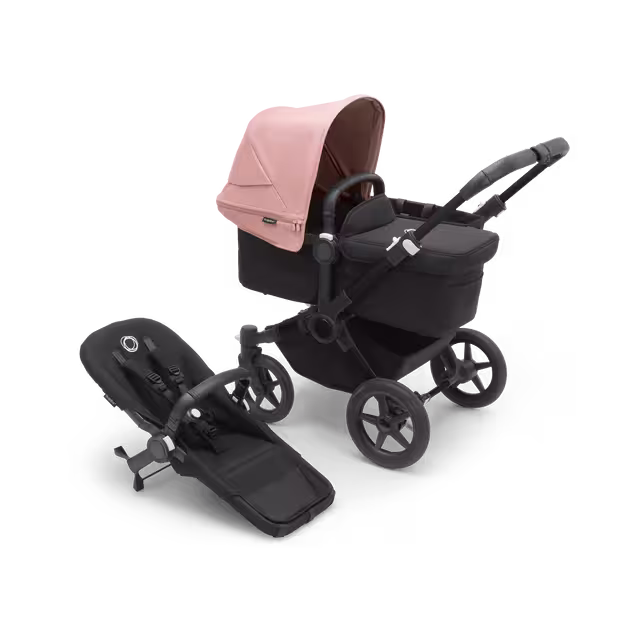 Refurbished Bugaboo Donkey 5 Mono bassinet and seat stroller black base, midnight black fabrics, morning pink sun canopy - Main Image Slide 1 of 9
