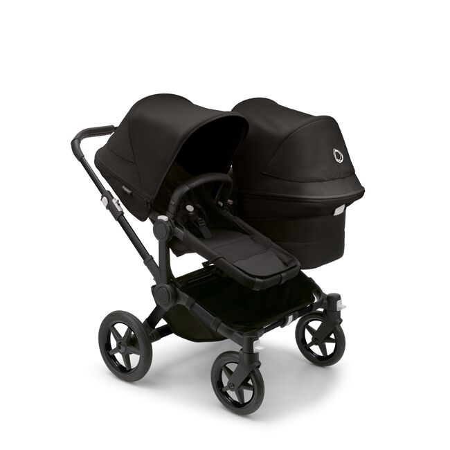 Bugaboo Donkey 5 Duo seat and bassinet stroller with black chassis, midnight black fabrics and midnight black sun canopy. - Main Image Slide 1 of 12