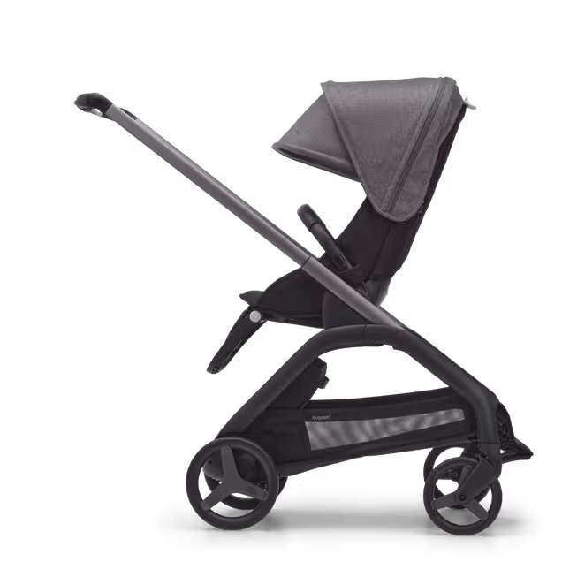 Side view of the Bugaboo Dragonfly seat stroller with graphite chassis, midnight black fabrics and grey melange sun canopy. - Main Image Slide 2 of 16