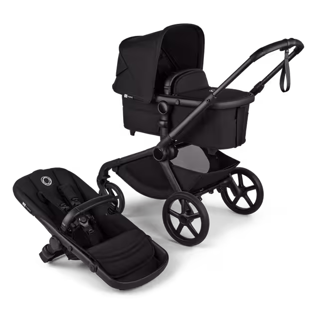Bugaboo Kangaroo 2-in-1 stroller with one bassinet, Midnight Black fabrics, and Midnight Black sun canopy. A detached seat in Midnight Black sits next to the stroller. - Main Image Slide 2 of 6