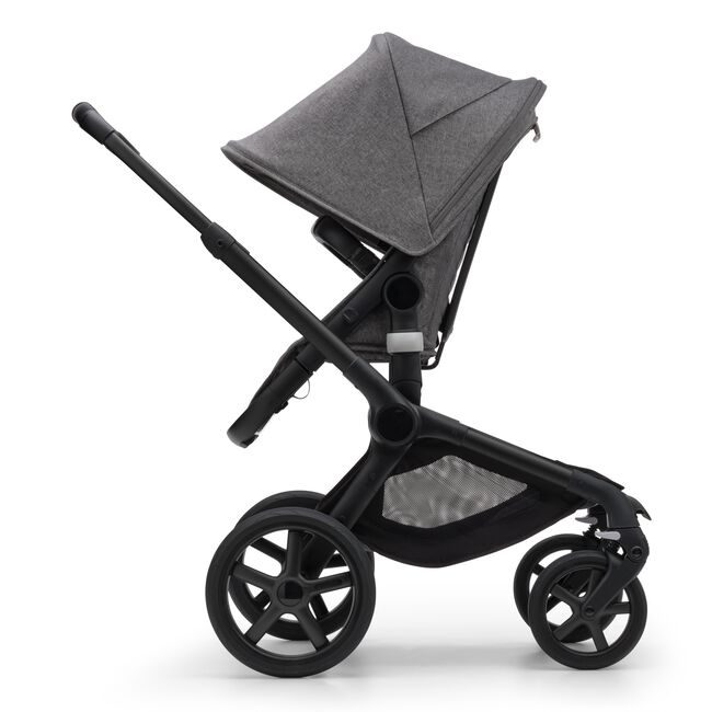 Side view of the Bugaboo Fox 5 seat stroller with black chassis, grey melange fabrics and grey melange sun canopy. - Main Image Slide 4 of 15