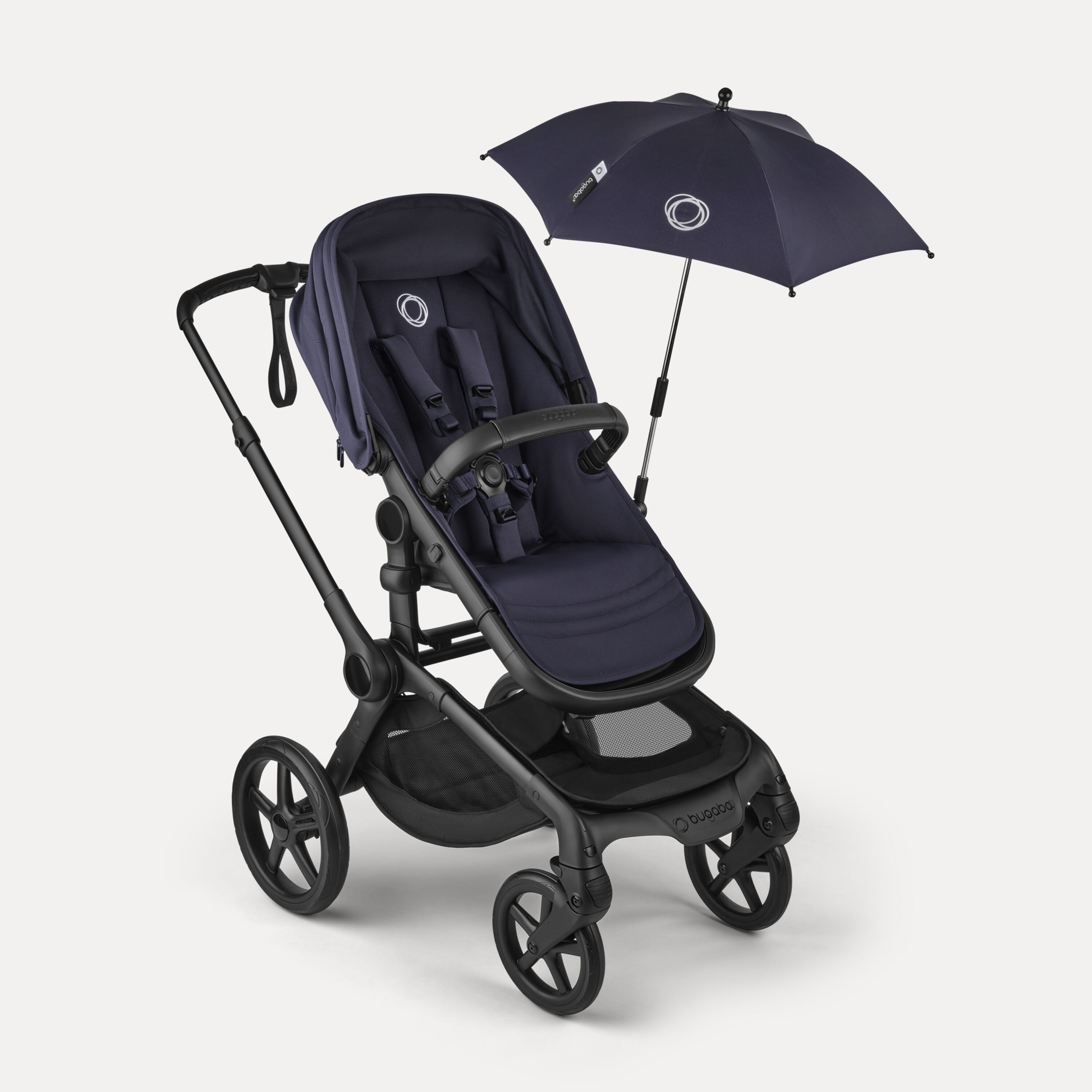Bugaboo Fox 5 Renew seat stroller with a parasol attached. The stroller and parasol feature dark blue fabrics. - Main Modal Image Slide 12 of 12