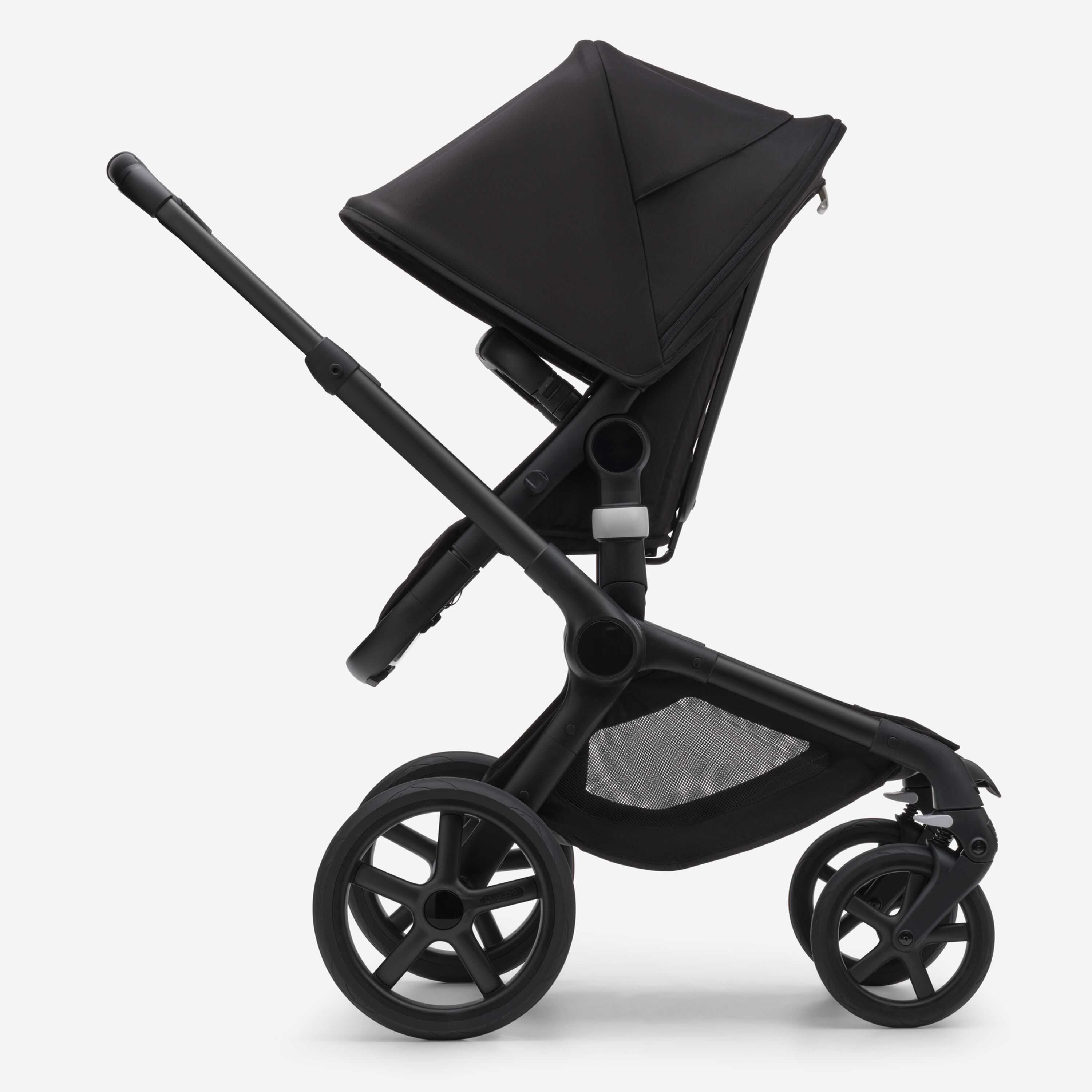 Side view of the Bugaboo Fox 5 seat pram with black chassis, forest green fabrics and forest green sun canopy. - Main Modal Image Slide 3 of 13