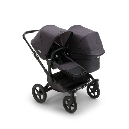 Bugaboo Donkey 5 Duo seat and bassinet stroller with black chassis, mineral washed black fabrics and mineral washed black sun canopy. - view 1