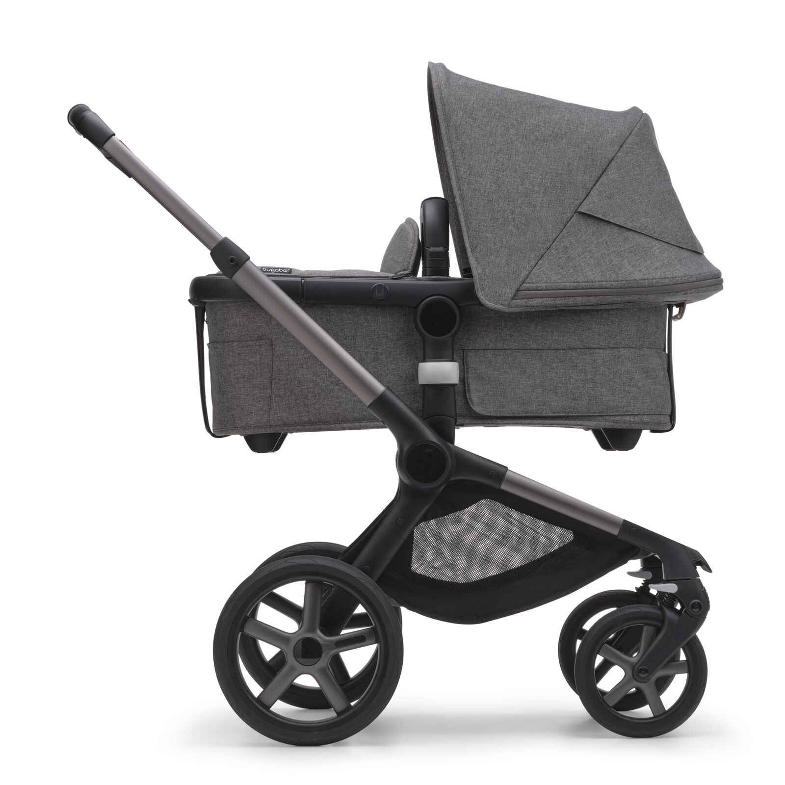Side view of the Bugaboo Fox 5 bassinet stroller with graphite chassis, grey melange fabrics and grey melange sun canopy.