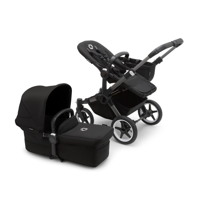 Bugaboo Donkey 5 Mono seat stroller with graphite chassis and midnight black fabrics, plus bassinet with midnight black sun canopy.