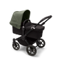 Bugaboo Donkey 5 Mono bassinet and seat stroller black base, midnight black fabrics, forest green sun canopy