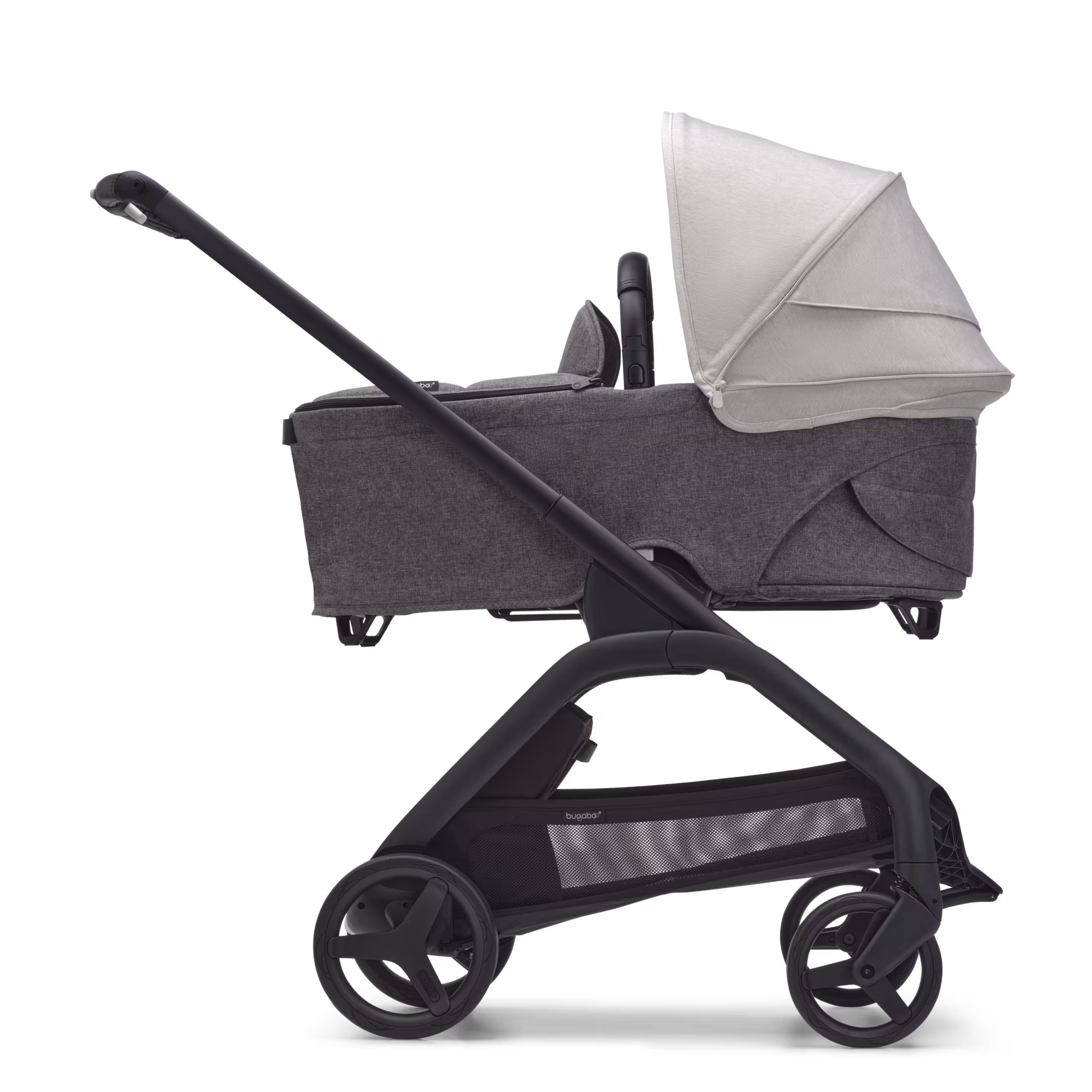 Side view of the Bugaboo Dragonfly bassinet stroller with black chassis, grey melange fabrics and misty white sun canopy. - Main Modal Image Slide 3 of 16