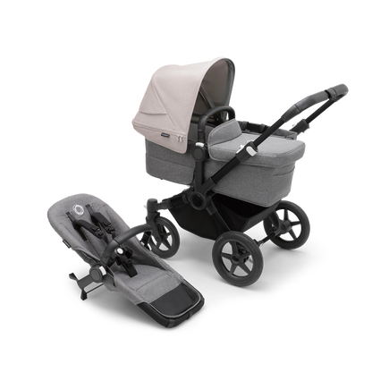 Bugaboo Donkey 5 Mono bassinet stroller with black chassis, grey melange fabrics and misty white sun canopy, plus seat.