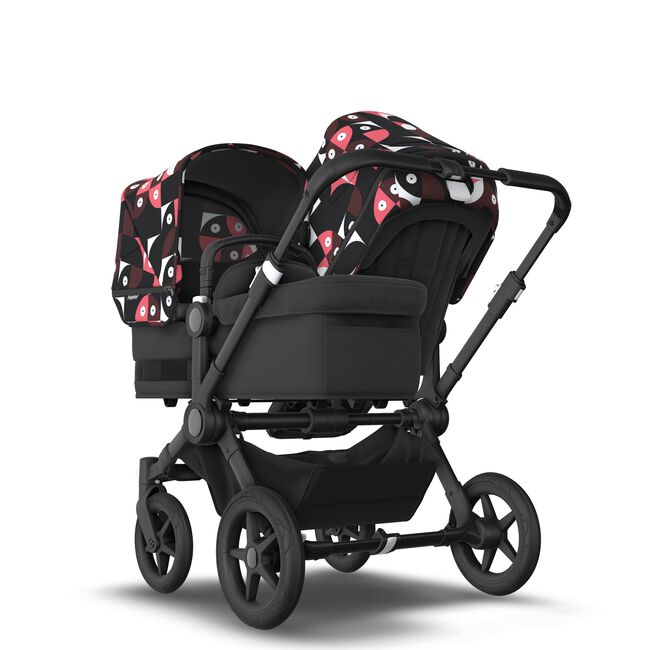 Bugaboo Donkey 5 Duo bassinet and seat stroller black base, midnight black fabrics, animal explorer pink/ red sun canopy