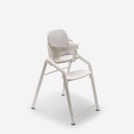Bugaboo Giraffe chair with baby set and baby pillow set in white.