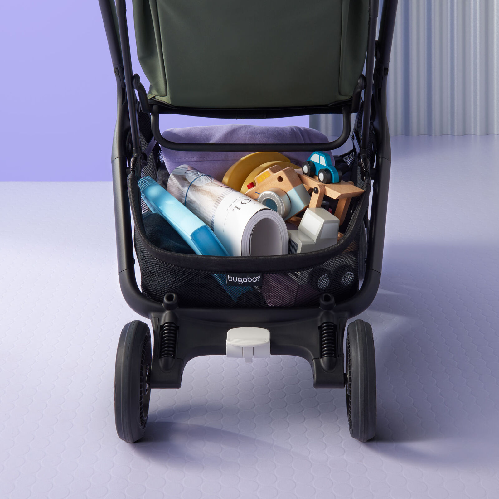 The underseat basket of the Bugaboo Butterfly stroller, with space for plenty of toys and baby essentials.
