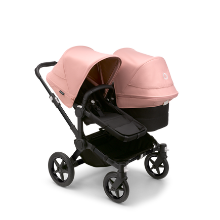 Bugaboo Donkey 5 Duo bassinet and seat stroller black base, midnight black fabrics, morning pink sun canopy - view 1