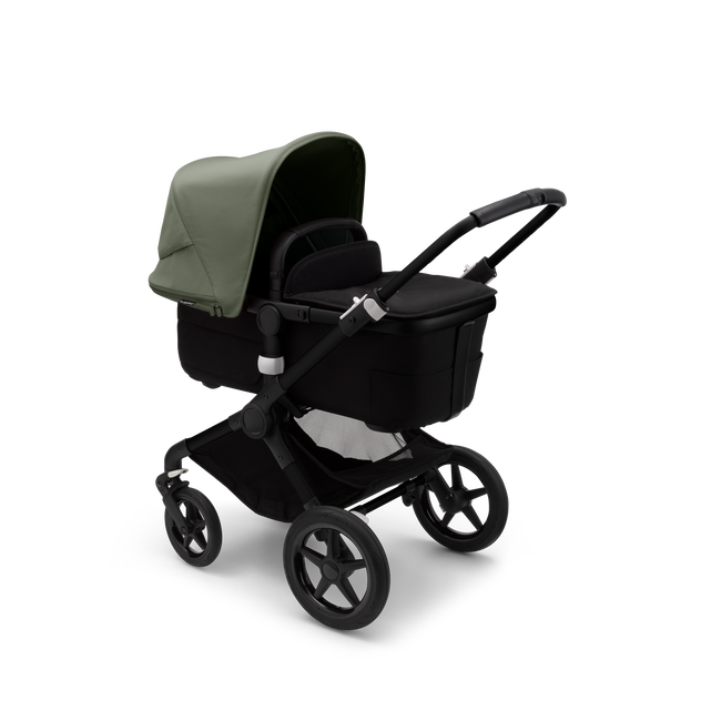 Bugaboo Fox 3 bassinet stroller with black frame, black fabrics, and forest green sun canopy.