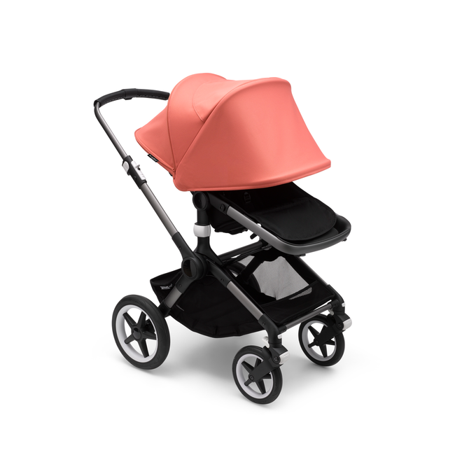 Bugaboo Fox 3 seat stroller with graphite frame, black fabrics, and red sun canopy fully extended.