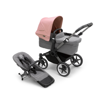 Bugaboo Donkey 5 Mono bassinet stroller with graphite chassis, grey melange fabrics and morning pink sun canopy, plus seat. - view 1