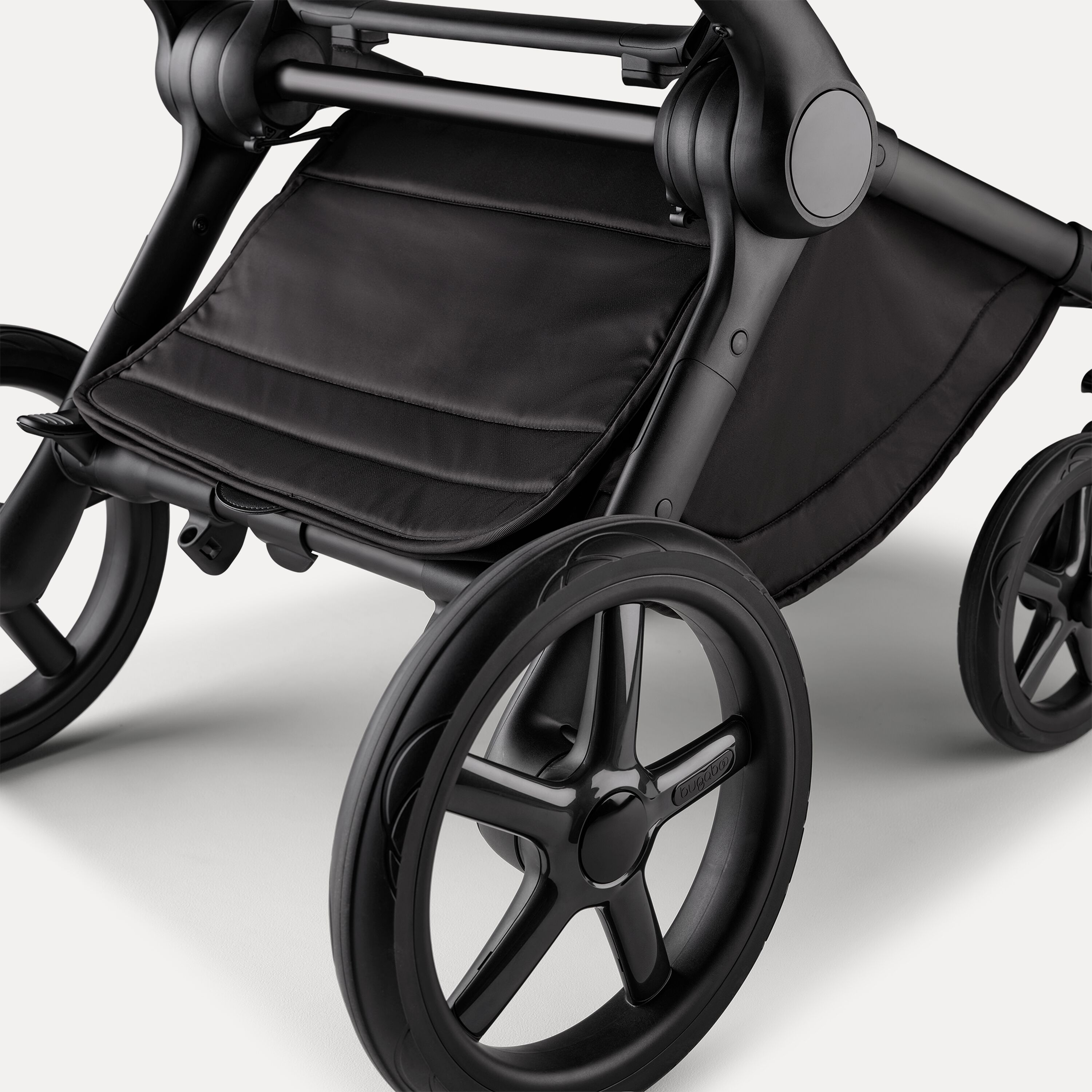 A close up of the underseat basket of the Bugaboo Fox 5 Noir Limited Edition stroller in Black Moonlight. - Main Modal Image Slide 6 of 15