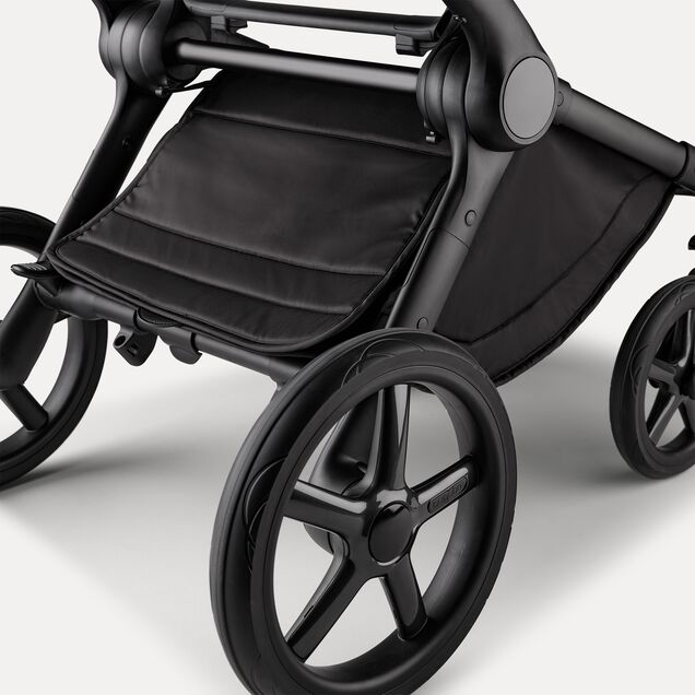 A close up of the underseat basket of the Bugaboo Fox 5 Noir Limited Edition stroller in Black Moonlight. - Main Image Slide 6 of 15