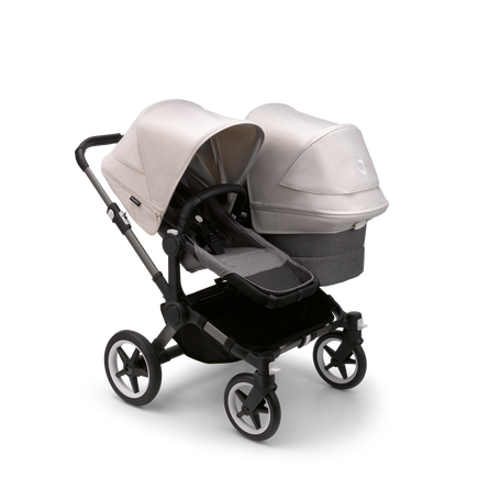 Bugaboo Donkey 5 Duo seat and bassinet stroller with graphite chassis, grey melange fabrics and misty white sun canopy.