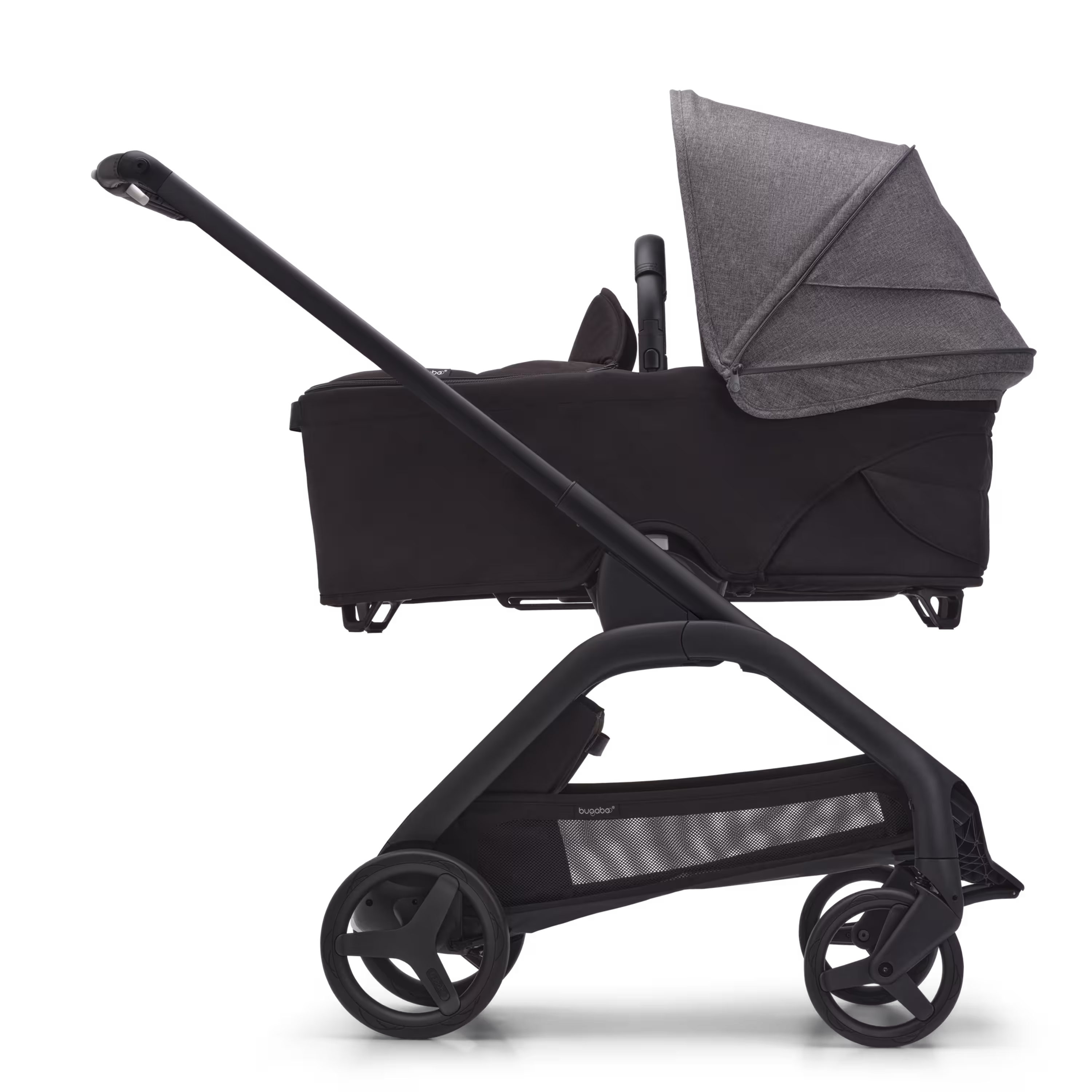 Side view of the Bugaboo Dragonfly bassinet stroller with black chassis, midnight black fabrics and grey melange sun canopy. - Main Modal Image Slide 3 of 16