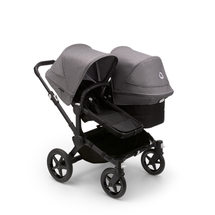 Bugaboo Donkey 5 Duo seat and bassinet stroller with black chassis, midnight black fabrics and grey melange sun canopy.