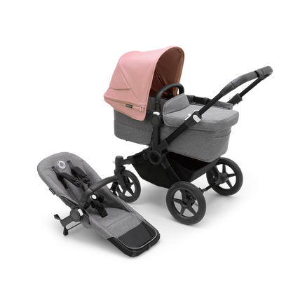 Bugaboo Donkey 5 Mono bassinet stroller with black chassis, grey melange fabrics and morning pink sun canopy, plus seat.