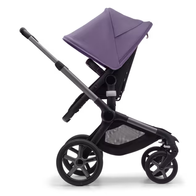 Side view of the Bugaboo Fox 5 seat stroller with graphite chassis, midnight black fabrics and astro purple sun canopy. - Main Image Slide 3 of 13