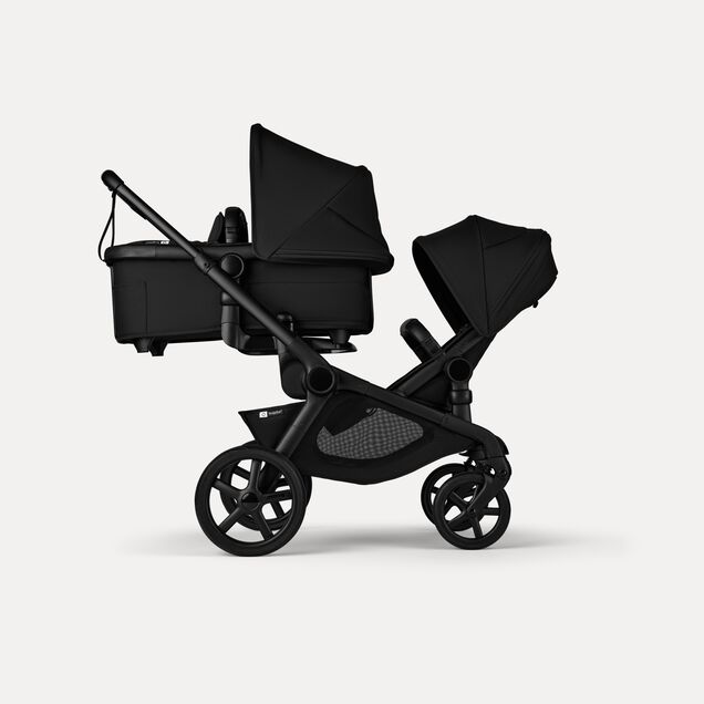 Bugaboo Kangaroo 2-in-1 tandem stroller with one bassinet above and one seat below, with Midnight Black fabrics and Midnight Black sun canopies. - Main Image Slide 2 of 18
