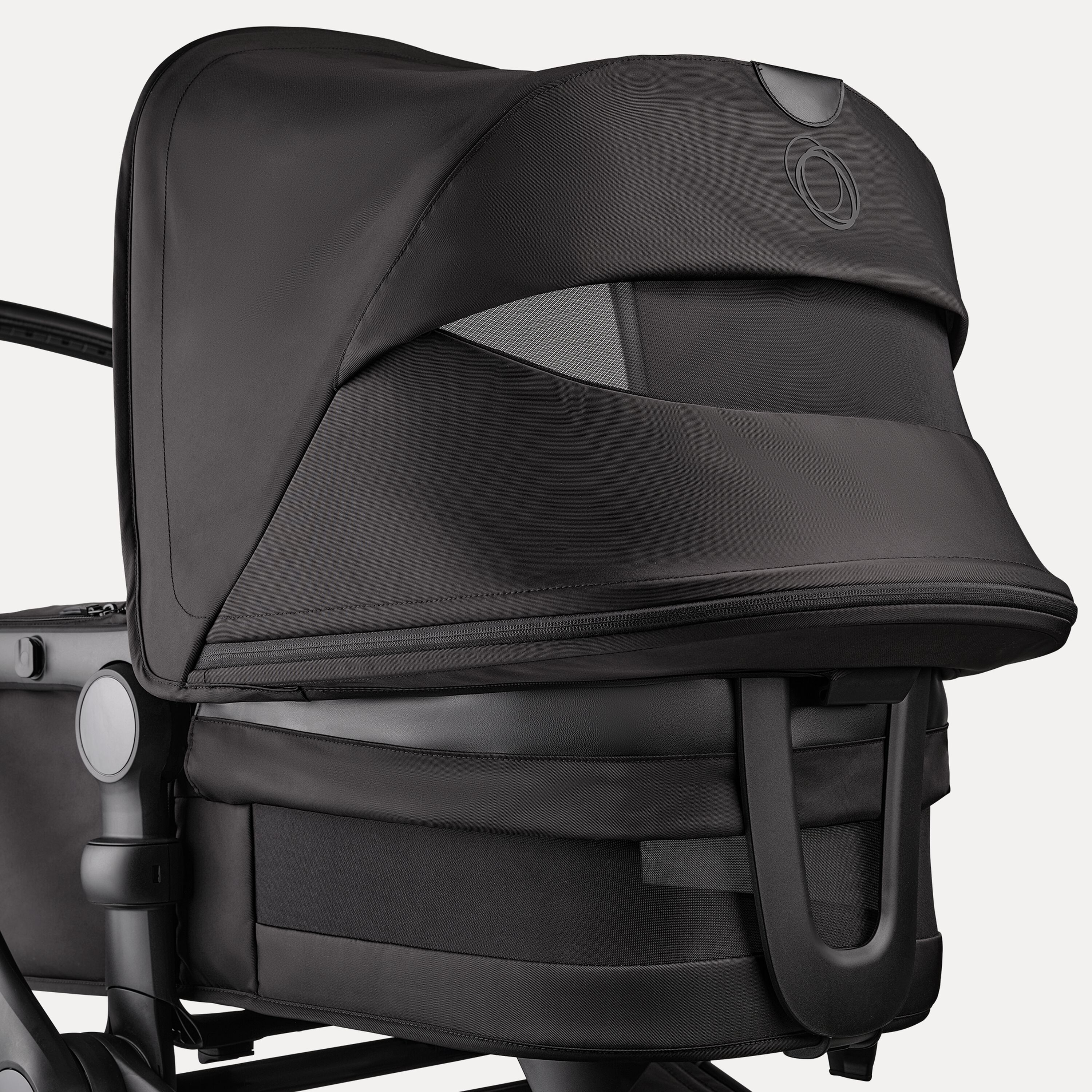 A close up of the sun canopy and the bassinet of the Bugaboo Fox 5 Noir Limited Edition Black Moonlight. The canopy and bassinet's breezy panels are visible. - Main Modal Image Slide 7 of 15