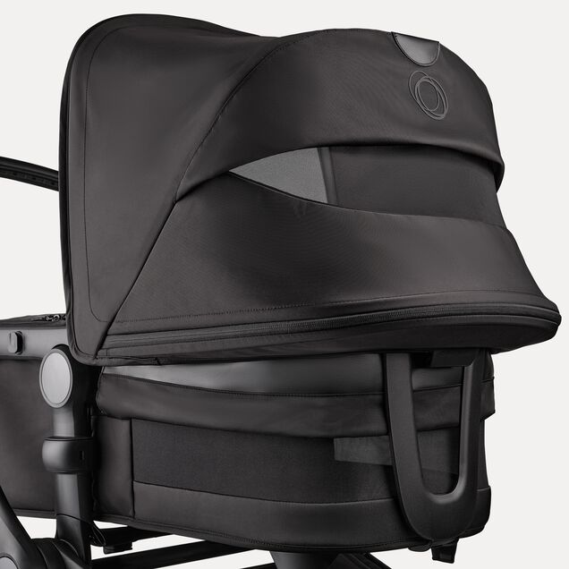 A close up of the sun canopy and the bassinet of the Bugaboo Fox 5 Noir Limited Edition Black Moonlight. The canopy and bassinet's breezy panels are visible. - Main Image Slide 7 of 15