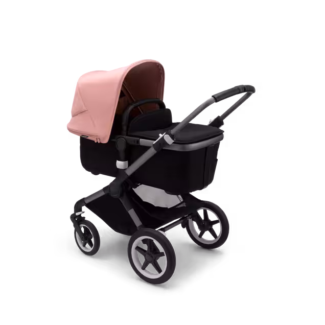 Bugaboo Fox 3 bassinet stroller with graphite frame, black fabrics, and pink sun canopy. - Main Image Slide 4 of 7