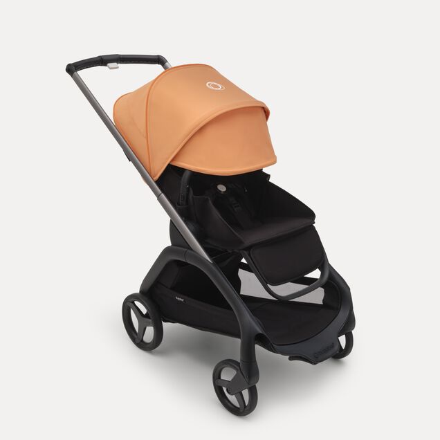 Bugaboo Dragonfly kinderwagen met stoel met graphite onderstel, midnight black bekleding en island coral zonnekap. De zonnekap is volledig uitgeschoven. - Main Image Slide 3 van 16