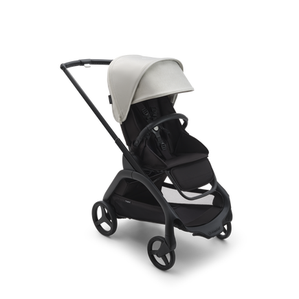 Bugaboo Dragonfly seat stroller with black chassis, midnight black fabrics and misty white sun canopy.