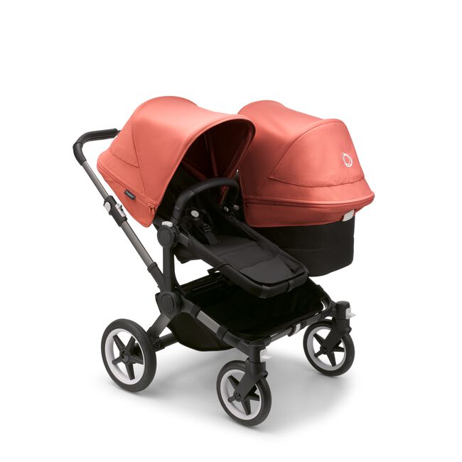Bugaboo Donkey 5 Duo seat and bassinet stroller with graphite chassis, midnight black fabrics and sunrise red sun canopy. - Main Image Slide 1 of 12